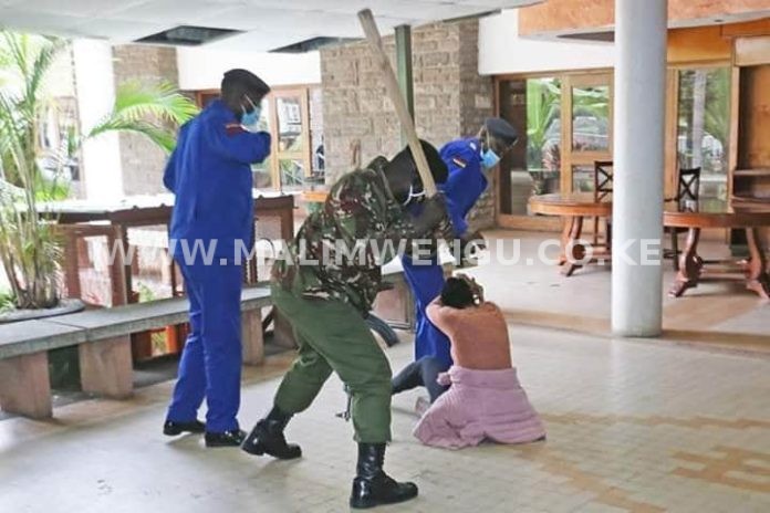 one police officer aimming to hit the Mlango kubwa MCA