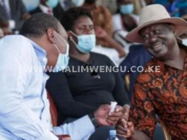 President Uhuru Kenyatta sharing a light moment with Raila Odinga