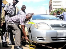 County officers clamping a car