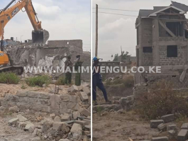 Bulldozer demolishing houses