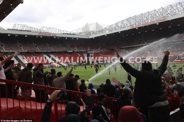Hundreds of Manchester United fans have stormed the pitch at Old a