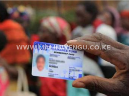 Image of a person holding an NHIF card